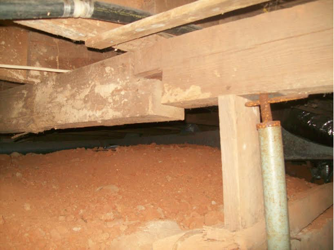 sagging support beam in a crawl space